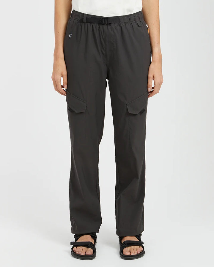 Person wearing black cargo pants on a white background