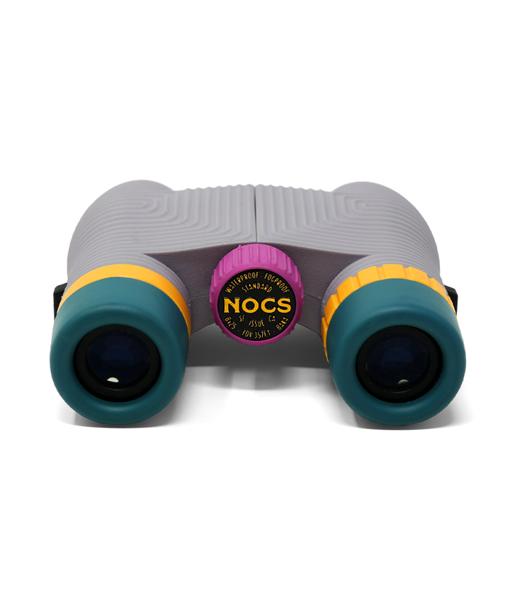 Lavender coloured compact binoculars viewed from the eye piece in.