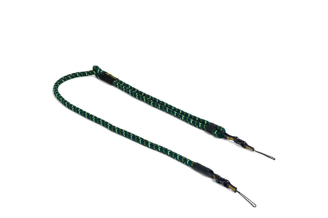 Green and black rope strap on a white background