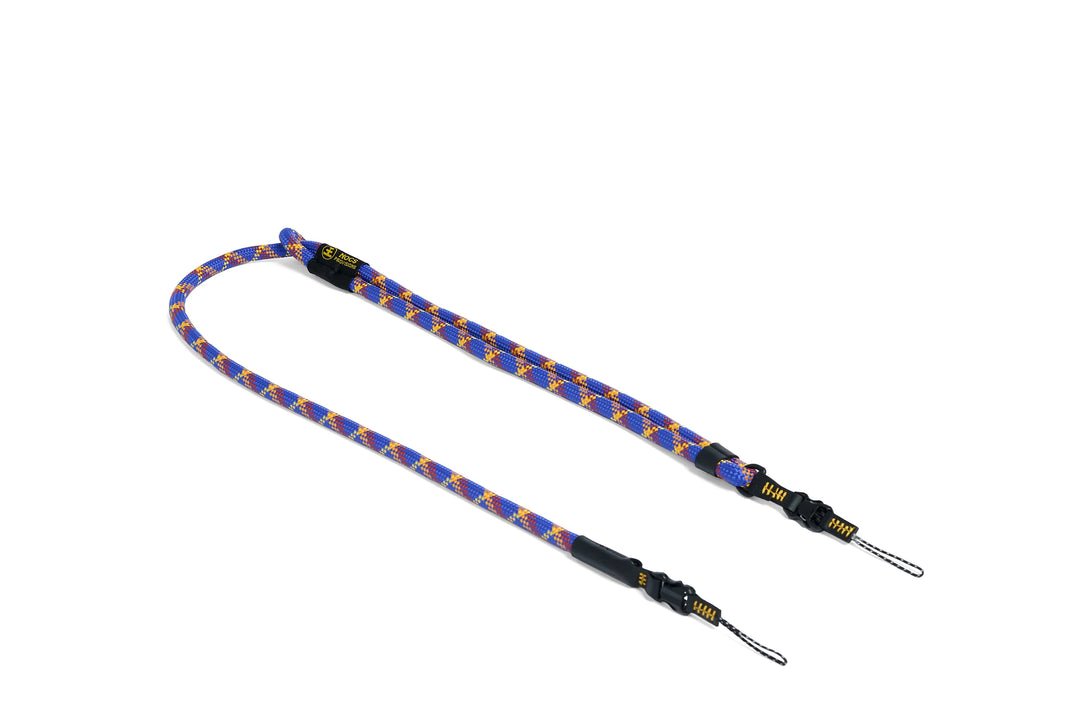 Blue and yellow rope strap with metal ends on a white background