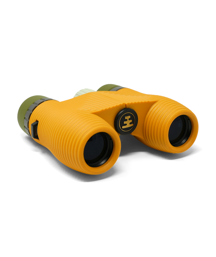Compact yellow binoculars on a white background