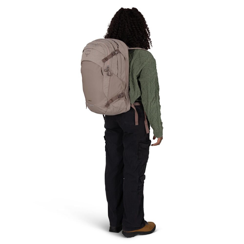 Person wearing a beige backpack on a white background