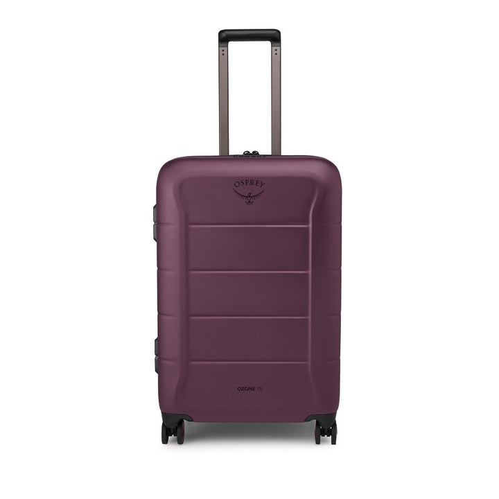 A hard-shell spinner suitcase in a deep plum purple color, featuring a telescoping handle extended upwards and the Osprey logo on the front, set against a plain white background.