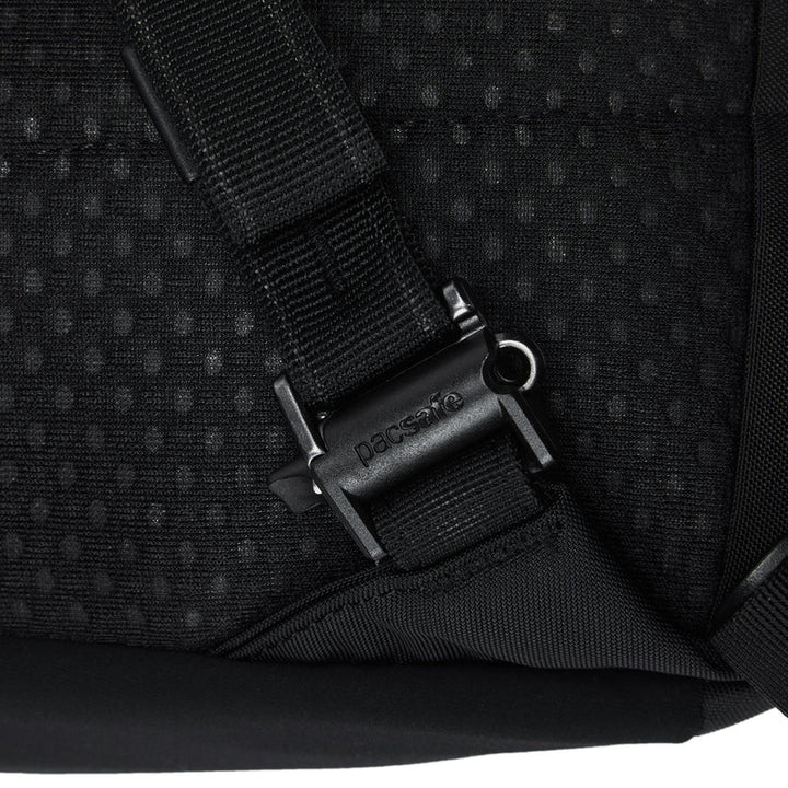 Close-up of a black backpack with a visible brand logo on a white background