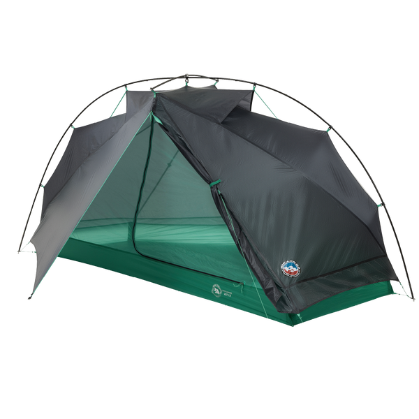 Green and dark grey hiking tent with open door.