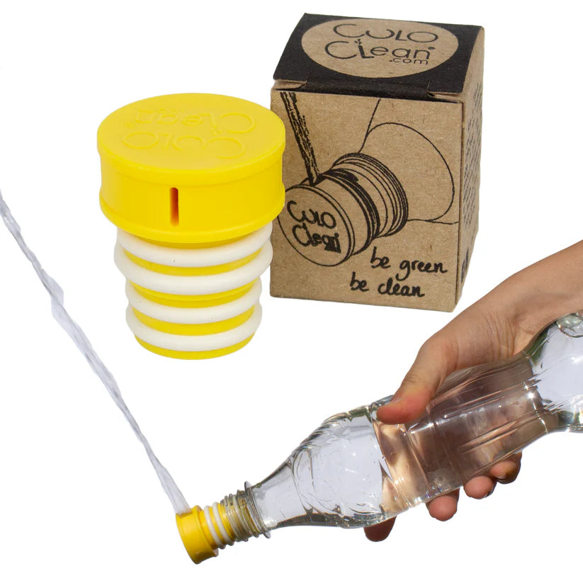 Yellow portable bidet screwed onto a plastic bottle and squirting water, packaging in background