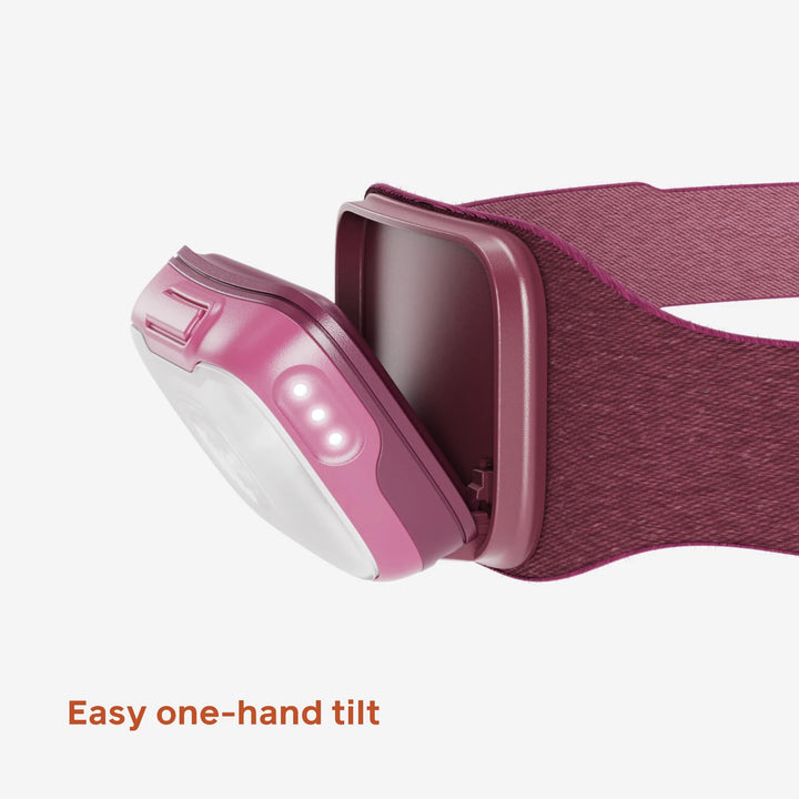 Pink headlamp with a strap on a white background
