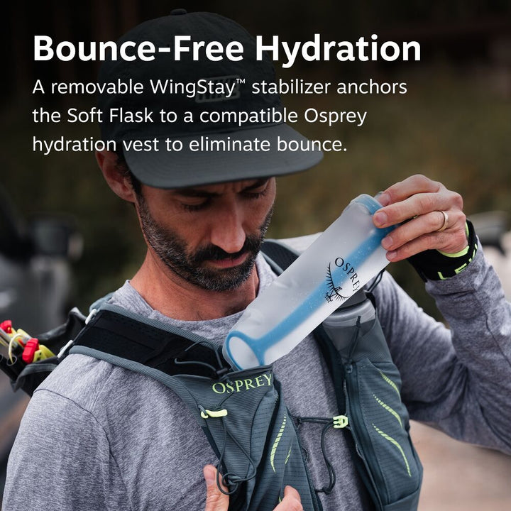Someone wearing an Osprey running backpack putting a transparent soft flask with Osprey logo on it into a front pocket. Image has "bounce-free hydration" written on top