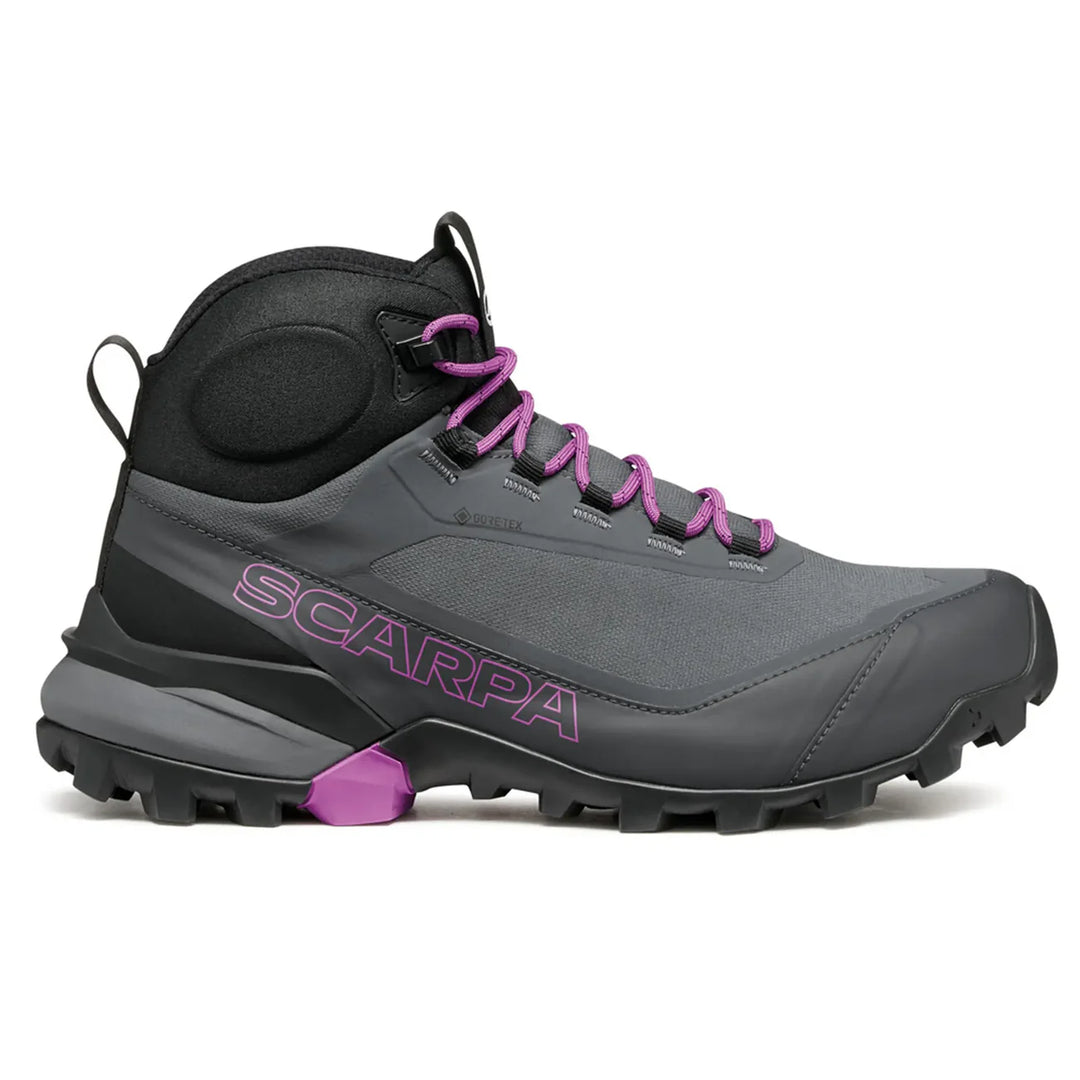 Gray hiking boot with purple accents and 'Scarpa' branding on a white background