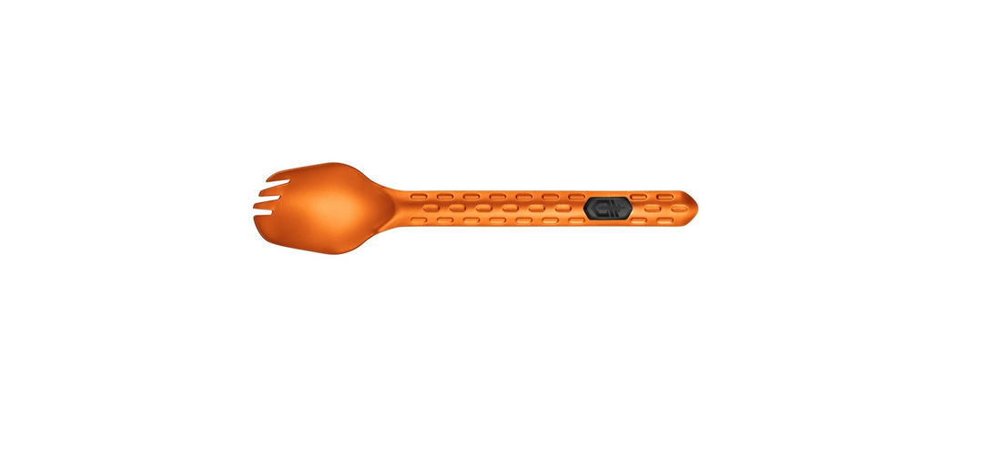 An orange spork-style handheld device with a textured handle and a small black rectangular logo, shown on a plain white background.