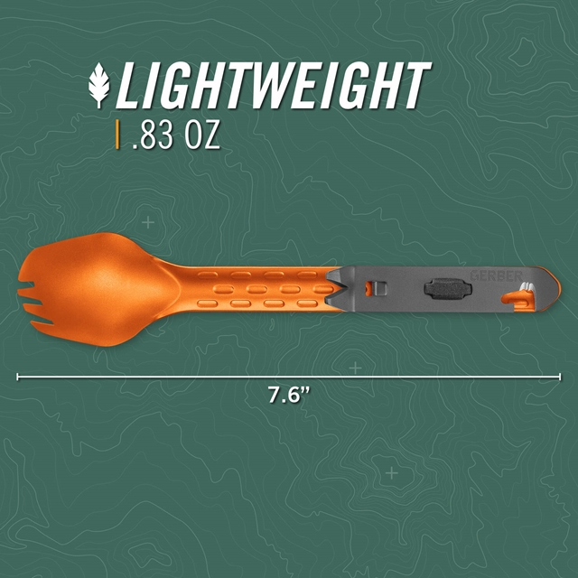 An orange and gray Gerber spork with a top handle, shown on a dark green topographic background with text reading &