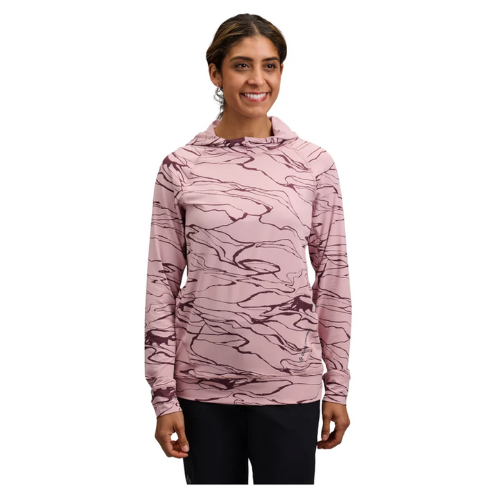Woman wearing a pink camouflage hoodie on a white background