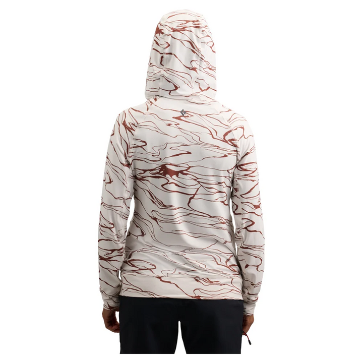 A person shown from the back wearing a hooded long-sleeve top with an abstract marbled pattern in reddish brown and off-white, paired with dark bottoms, on a plain white background.