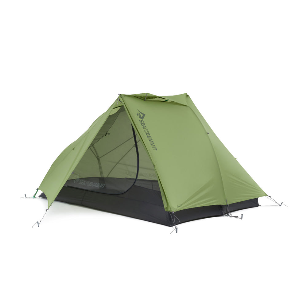Green hiking tent with one door open on a white background