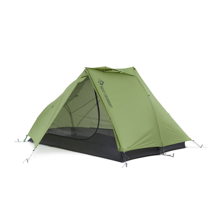 Green hiking tent with one door open on a white background