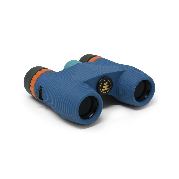 Compact blue binoculars with orange accents on a white background