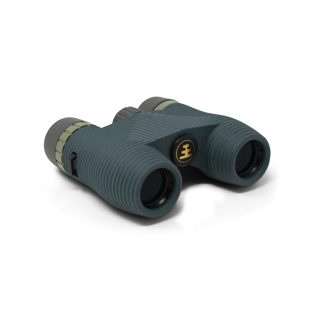 Dark green compact binoculars with Nocs Provisions logo