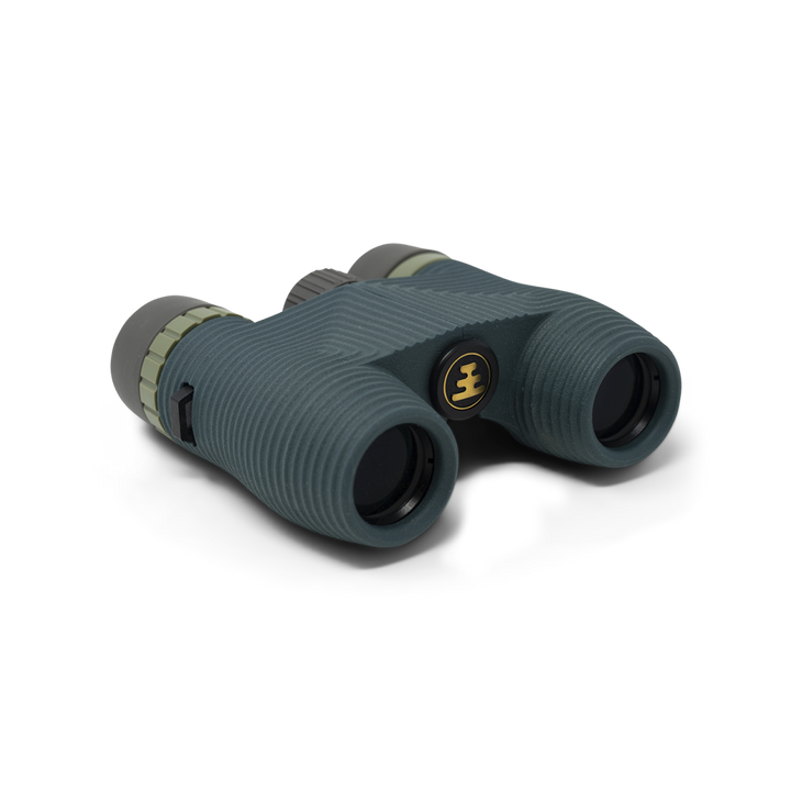 Dark green compact binoculars with Nocs Provisions logo