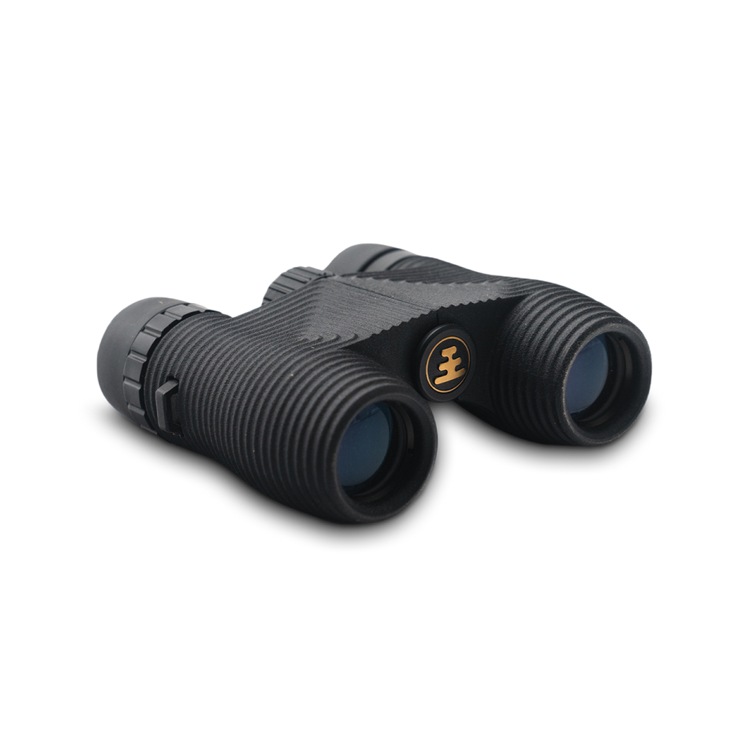 Compact black binoculars on a white background