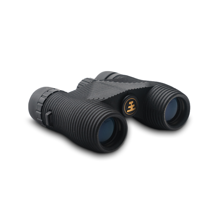 Compact black binoculars on a white background