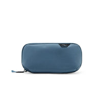 Blue accessory pouch with brand logo on a white background