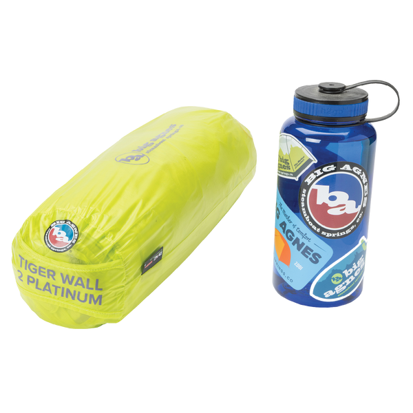 Yellow tent in bag next to blue water bottle