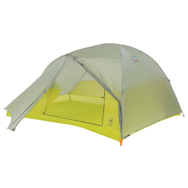 Green and yellow tent with open door on a white background
