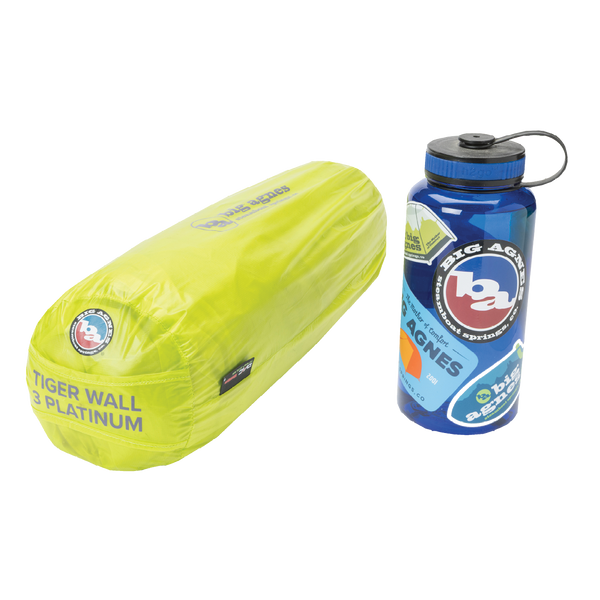Yellow tent in bag next to blue water bottle.