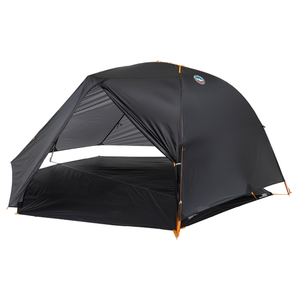 Grey hiking tent fly pitched on a grey footprint without an inner tent