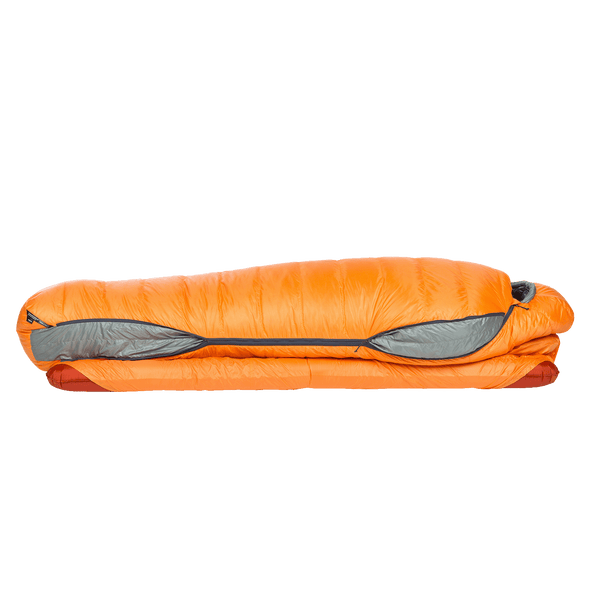 Orange sleeping bag on red sleeping mat, showing side zips and a pad attachment system