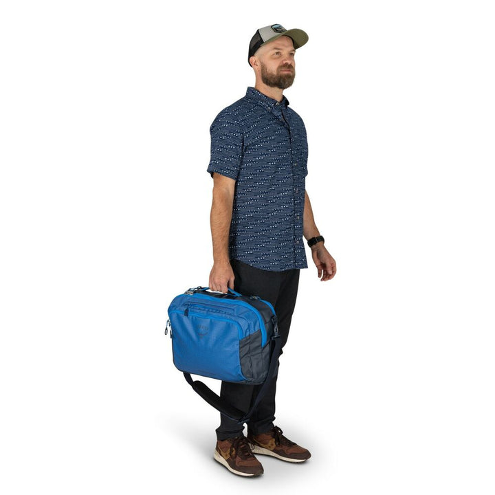 Man holding a blue bag on a white background