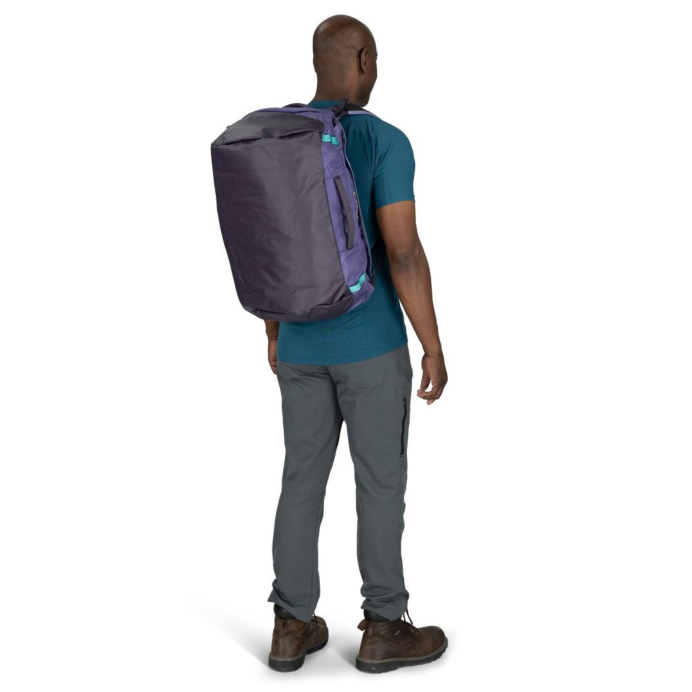 Person wearing a purple backpack on a white background