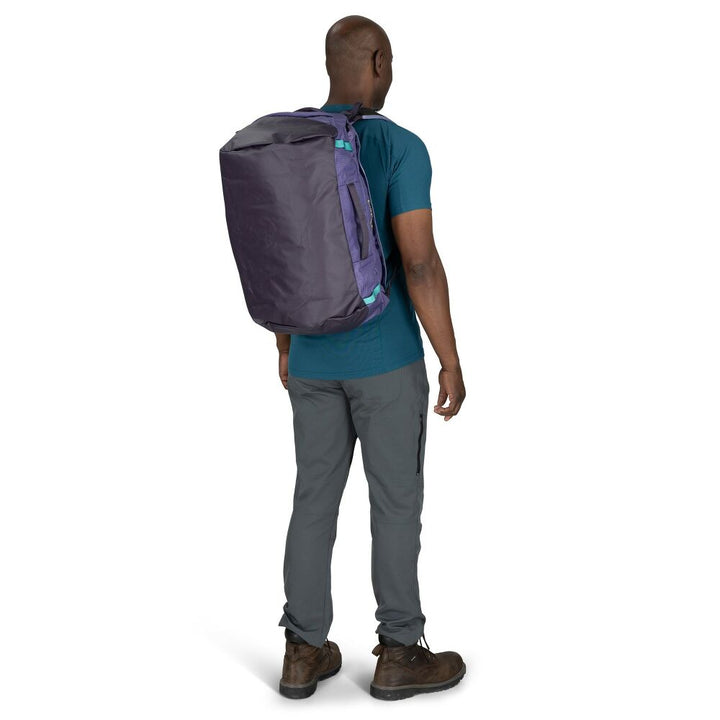 Person wearing a purple backpack on a white background