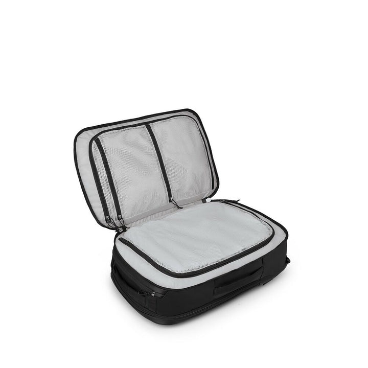 Black suitcase with open compartment on a white background