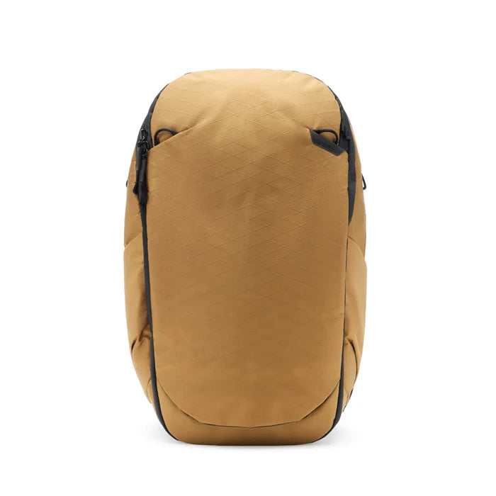 Brown backpack with black zippers on a white background