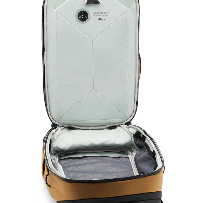 Open backpack with visible interior compartments on a white background