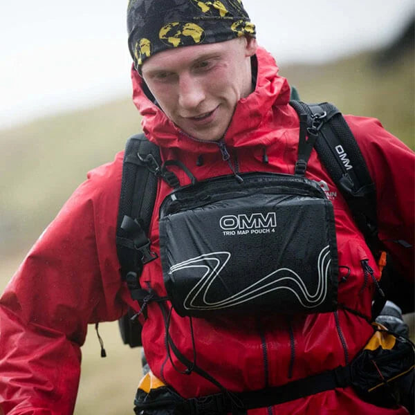 OMM Trio Map Pouch in Black, worn while racing