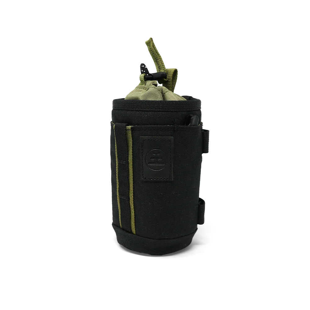 A black cylindrical pouch or sleeve with olive green accents, including a top loop and side piping, shown on a plain white background.