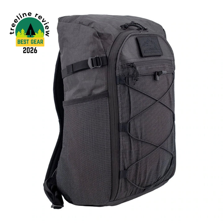 A dark gray tactical backpack with black straps and zippers, shown on a plain white background. A &