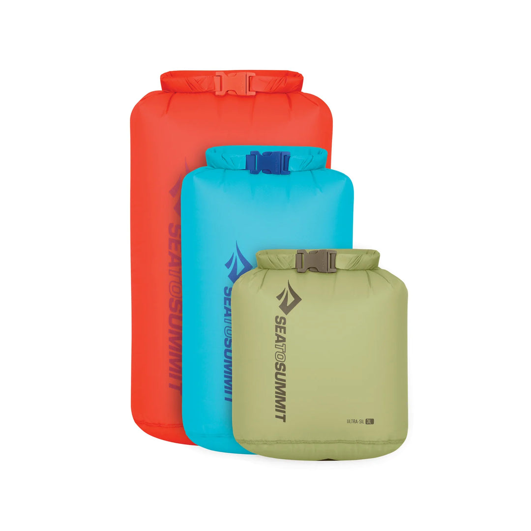 Three dry bags in red, blue, and green with Sea to Summit logo on a white background