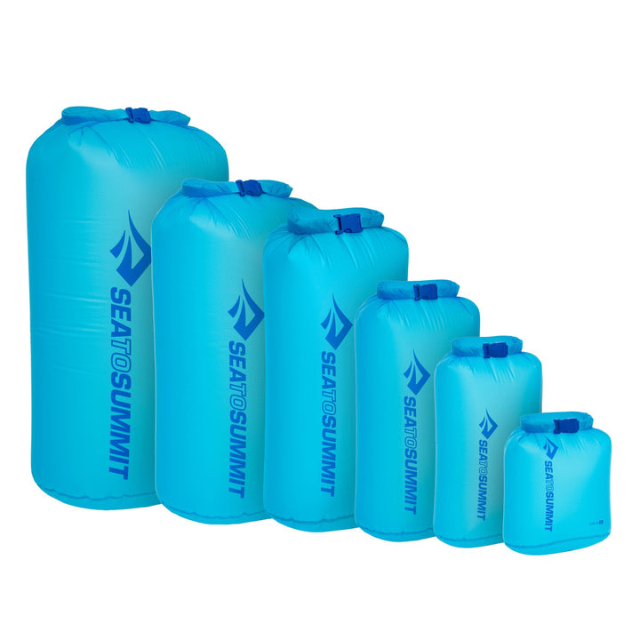 A set of five blue dry bags in descending size order