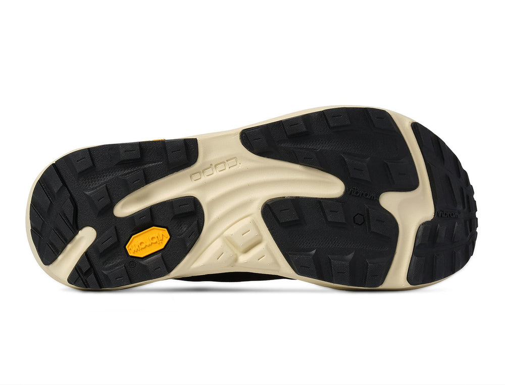 Close-up of a shoe sole with a brand logo on a white background