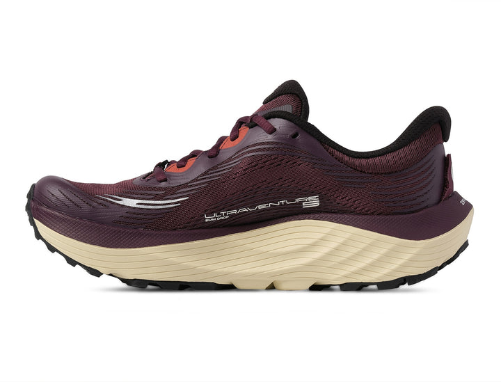 White running shoes with black and gray design on a white background