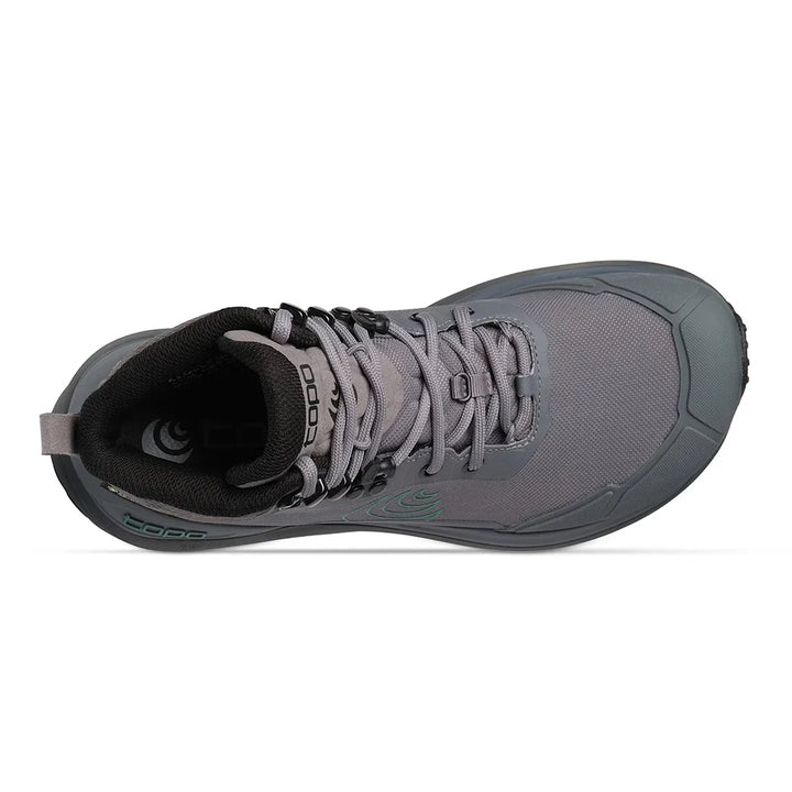 A gray mid-cut hiking boot with a dark gray sole, black laces, and a green circular logo on the side, shown against a plain white background.
