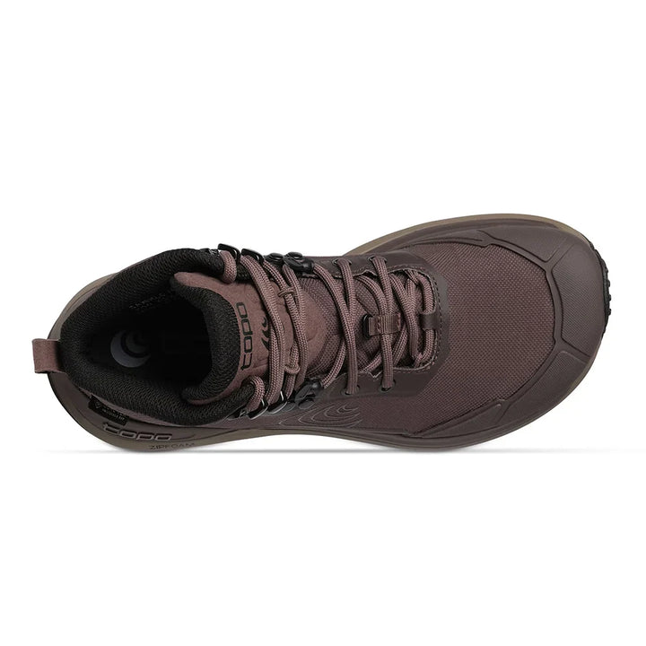 A single brown TOPO midfoot hiking boot shown from a side profile view against a plain white background.