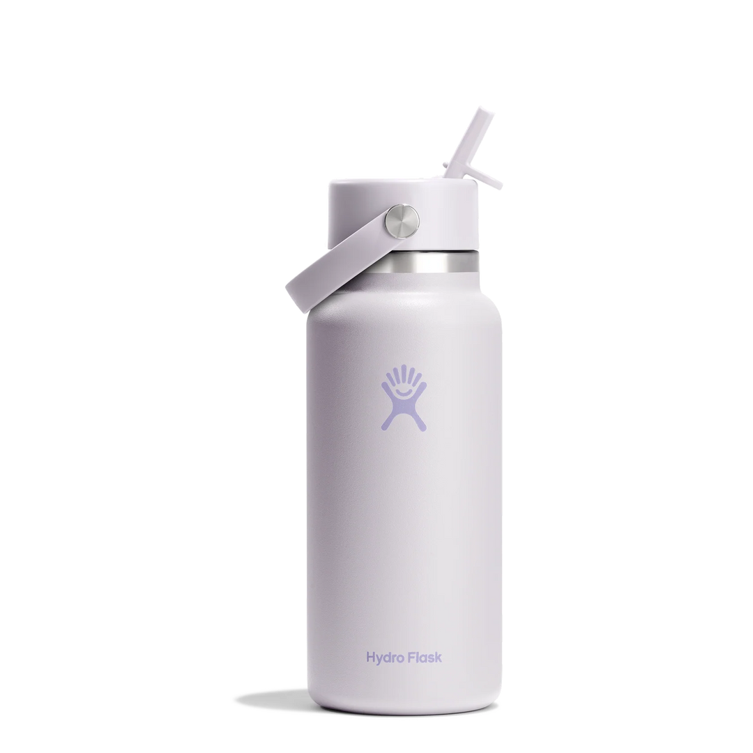 A Hydro Flask insulated water bottle in a pale lavender color, featuring the brand&
