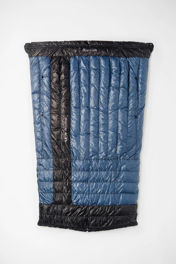 Blue sleeping quilt opened up with black edges and neve gear branding. 