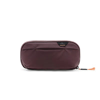 Brown travel pouch with a visible brand logo on a white background