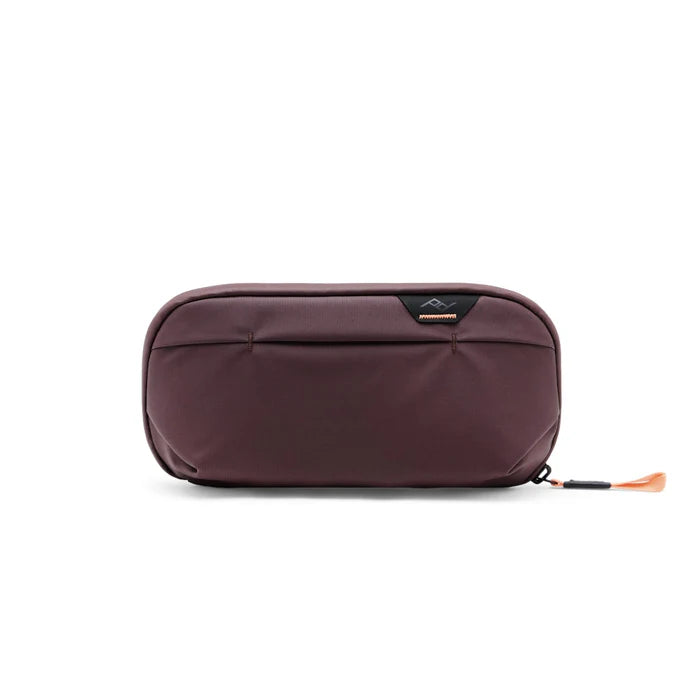 Brown travel pouch with a visible brand logo on a white background