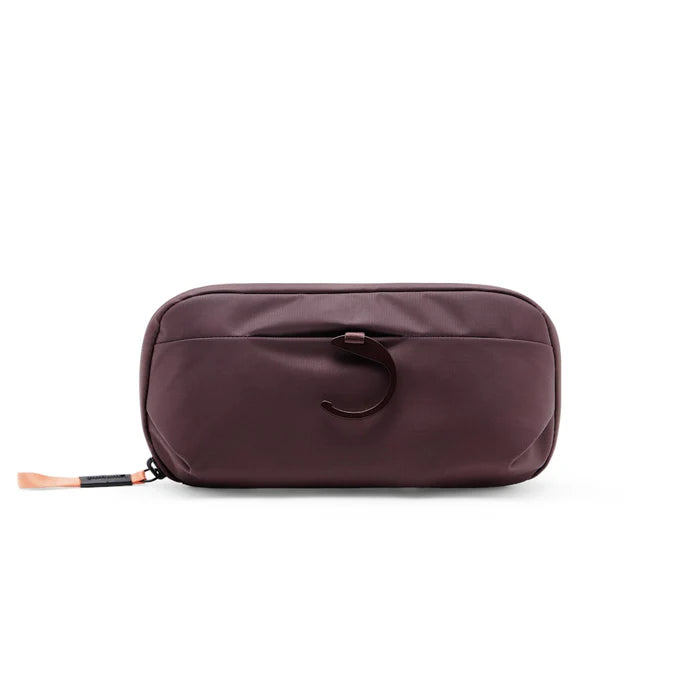 Brown toiletry bag with a hook on a white background